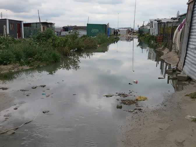 Sewage gushes out of drain in Khayelitsha GroundUp